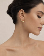 Female model wearing 14K Pleated Hoop Earrings
