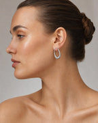 Female model wearing 14K Bold U Hoop Earrings