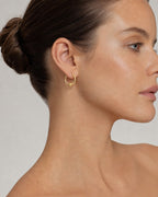 Female model wearing 14K Gold Pearl Hoop Earrings