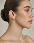 Female model wearing 14K Two-Tone Dolly Circle Hoop Earrings