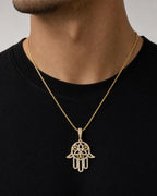 Male model wearing 14K Floral Hamsa Diamond Pendant