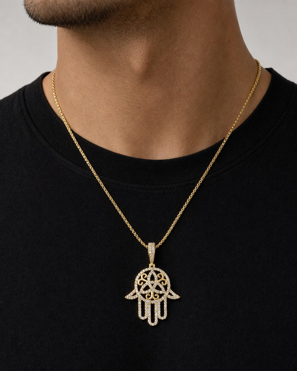 Male model wearing 14K Floral Hamsa Diamond Pendant