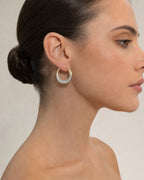 Female model wearing 14K Greek Hoop Earrings