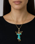 Female model wearing 14K Baby Jesus Enamel Diamond Pendant