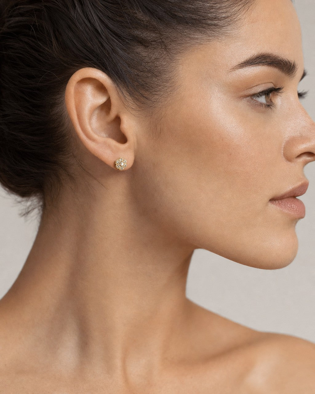 Female model wearing 14K Flower Earrings