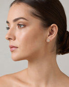 Female model wearing 14K Flower Diamond Earrings 0.9ct