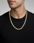 Male model wearing 10K 6MM Herringbone Chain 16"