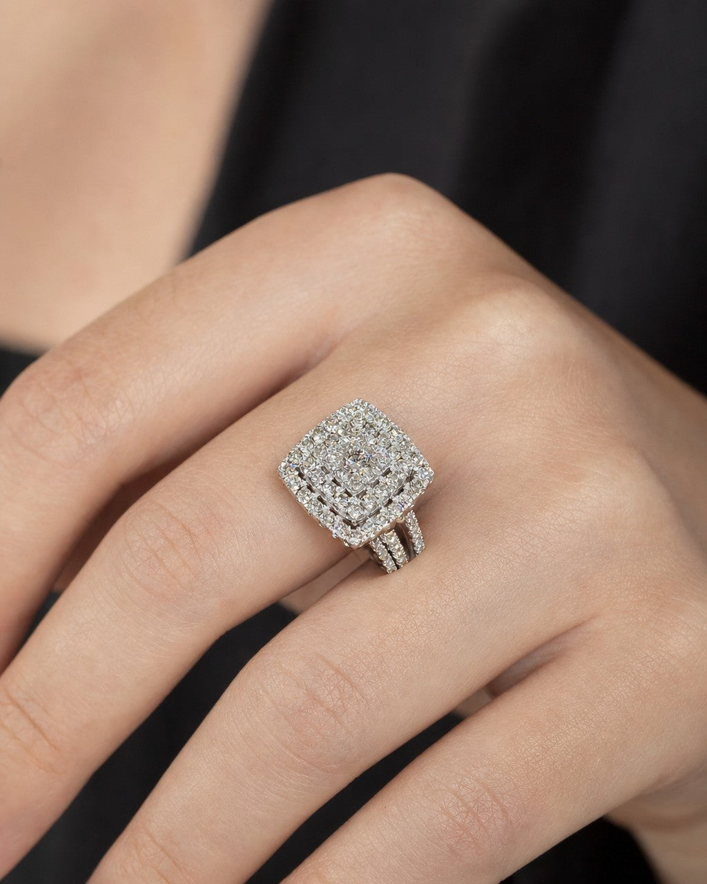 Female model wearing 14K Square Halo Circle Center Stone Engagement Ring