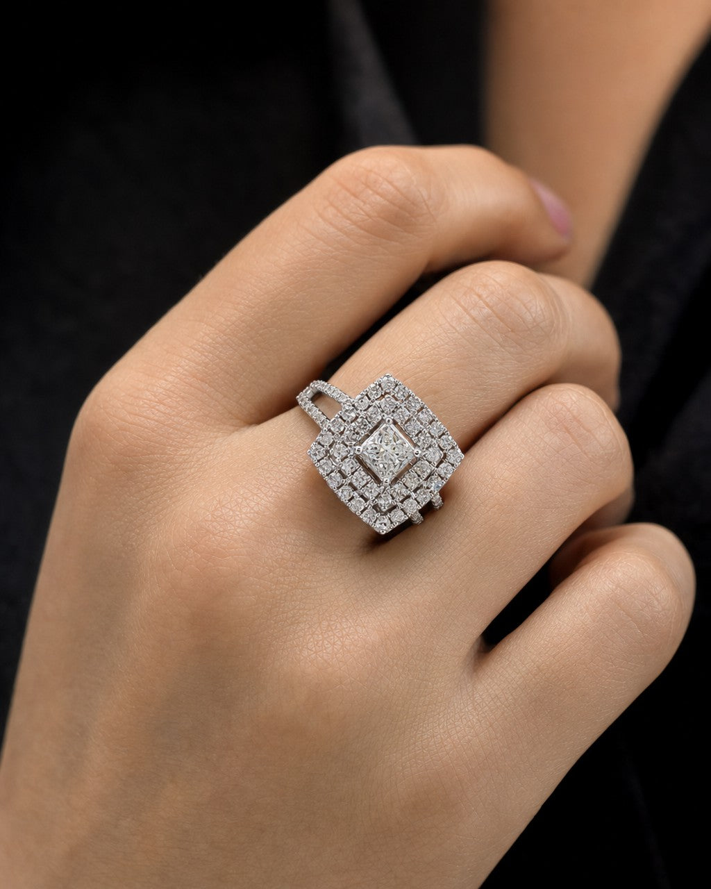 Female model wearing 14K Square Halo Baguette Center Stone Engagement Ring