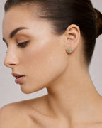 Female model wearing 10K Classic Heart Diamond Earrings