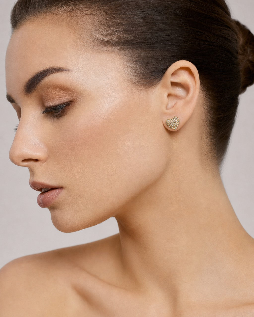 Female model wearing 10K Classic Heart Diamond Earrings