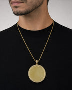 Male model wearing 10K Circle Photo Diamond Pendant