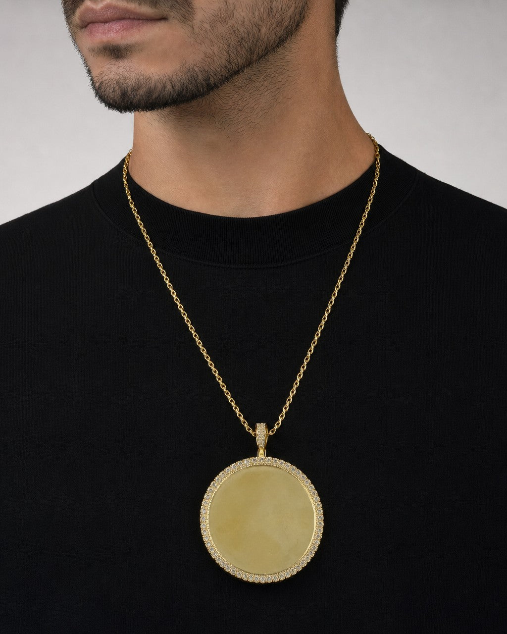 Male model wearing 10K Circle Photo Diamond Pendant