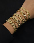 Male model wearing 14K Solid Gold Cuban Link Bracelet