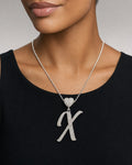 Female model wearing 14K Initial X Script Heart Diamond Pendant