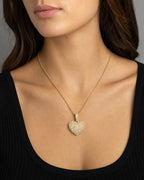 Female model wearing 10K Heart Diamond Pendant