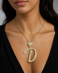 Female model wearing 14K Initial D Script Heart Diamond Pendant