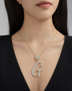 Female model wearing 14K Initial G Script Heart Diamond Pendant
