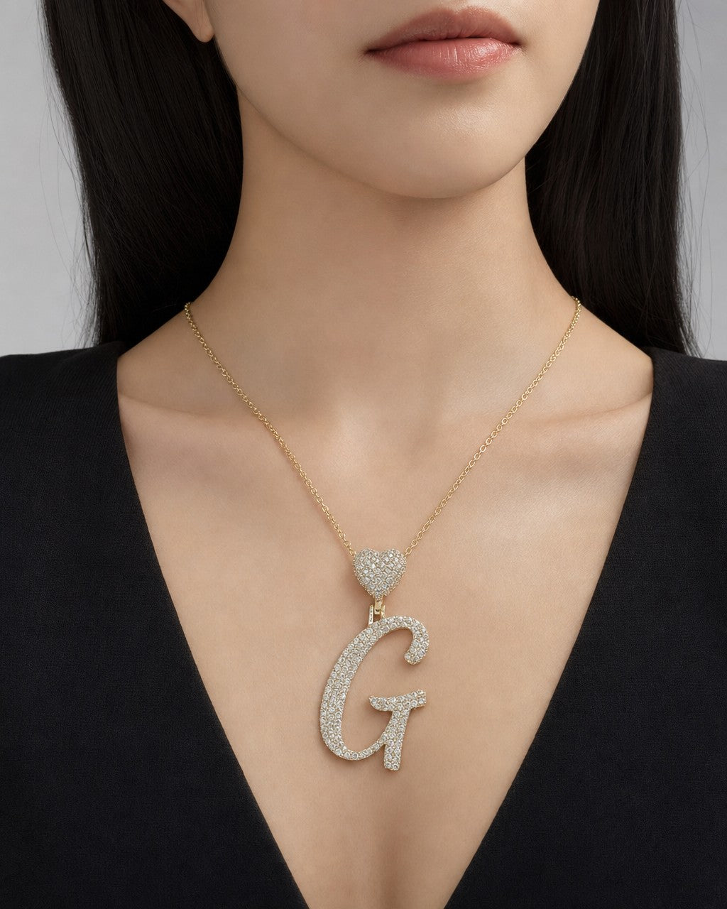 Female model wearing 14K Initial G Script Heart Diamond Pendant