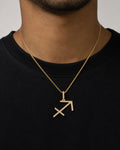 Male model wearing 10K Sagittarius Sign Diamond Pendant