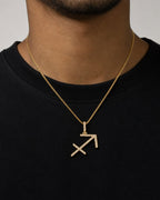 Male model wearing 10K Sagittarius Sign Diamond Pendant
