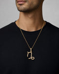 Male model wearing 10K Capricorn Sign Diamond Pendant