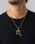 Male model wearing 10K Scorpio Sign Diamond Pendant