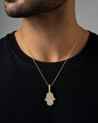 Male model wearing 14K Dainty Hamsa Diamond Pendant