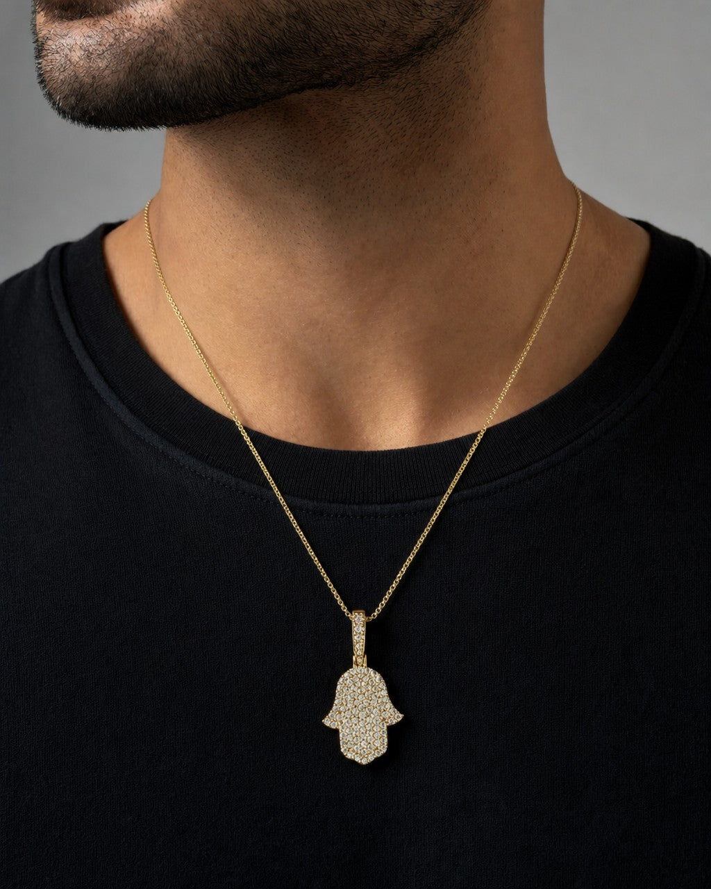 Male model wearing 14K Dainty Hamsa Diamond Pendant