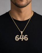 Male model wearing 14K 646 Area Code Diamond Pendant