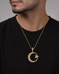 Male model wearing 10K Star Moon Diamond Pendant