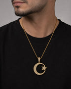 Male model wearing 10K Star Moon Diamond Pendant