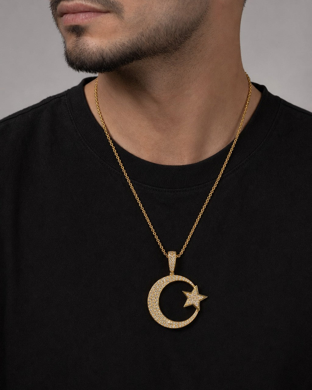 Male model wearing 10K Star Moon Diamond Pendant
