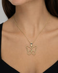 Female model wearing 10K Butterfly Diamond Pendant
