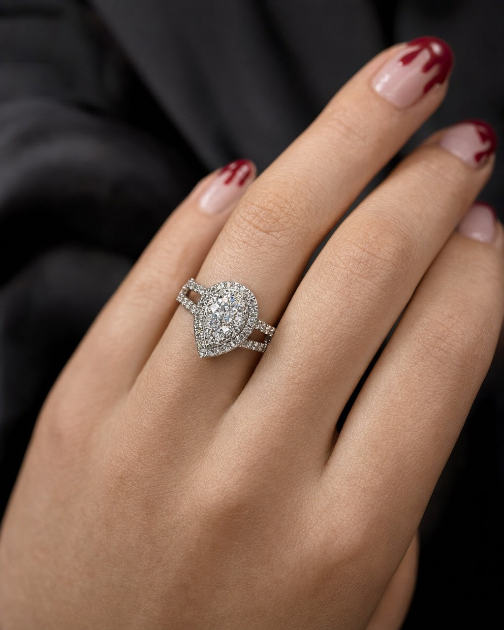 Female model wearing 14K Cherish Halo Pear Diamond Engagement Ring