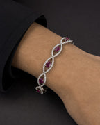 Male model wearing 18K Ruby Evil Eye Diamond Bracelet 7"