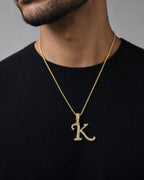 Male model wearing 10K Cursive K Initial Diamond Pendant