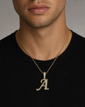 Male model wearing 10K Cursive A Initial Diamond Pendant
