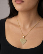 Female model wearing 14K Icy Heart Diamond Pendant