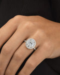Female model wearing Custom 18K Luxe Halo Oval Diamond Engagement Ring