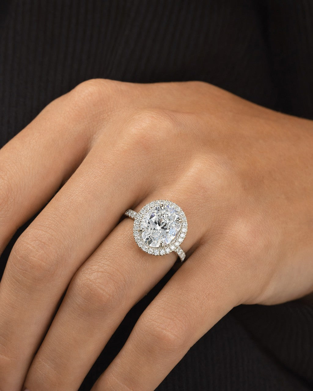 Female model wearing Custom 18K Luxe Halo Oval Diamond Engagement Ring