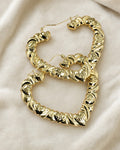 10K Puff Heart Shape Hoop Earrings styled photo