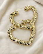10K Puff Heart Shape Hoop Earrings styled photo