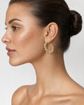 Female model wearing 10K Braided Hoop Earring