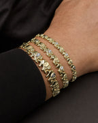 Male model wearing 10K Elephant Link Bracelet 7.5"