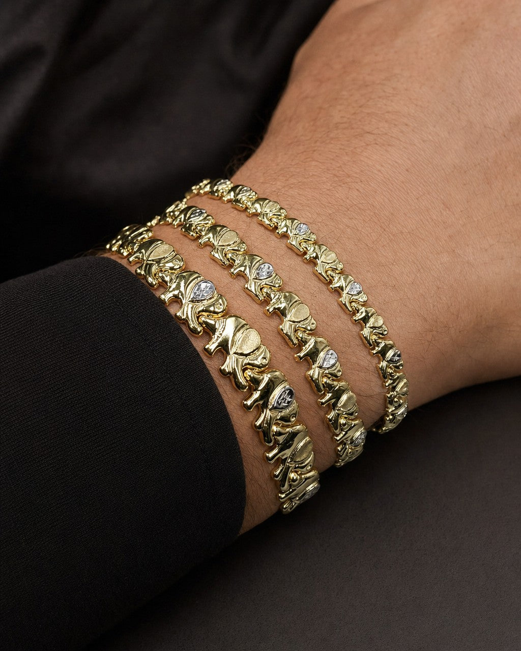 Male model wearing 10K Elephant Link Bracelet 7.5"