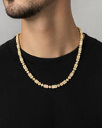 Male model wearing 10K 6MM Diamond Baguette Geometric Link Chain 22"