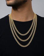 Male model wearing 10K 6MM Two-Tone Flat Cuban Link Chain 22-26"
