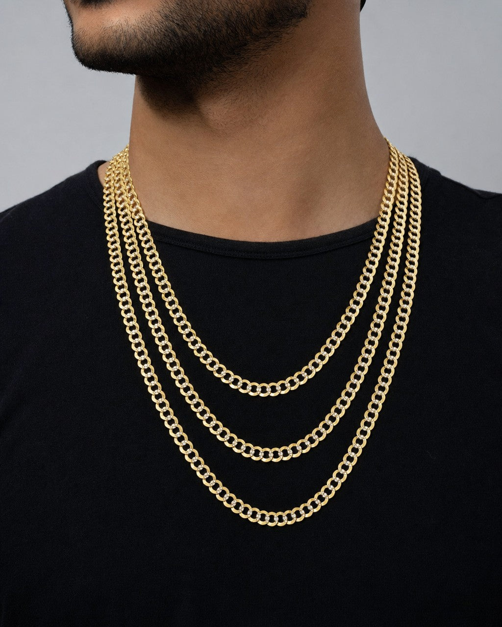 Male model wearing 10K 6MM Two-Tone Flat Cuban Link Chain 22-26"