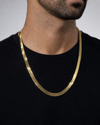 Male model wearing 10K 9MM Herringbone Link Necklace 24"
